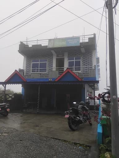 Paul's Hotel wrapped in hill fog at Charles Point