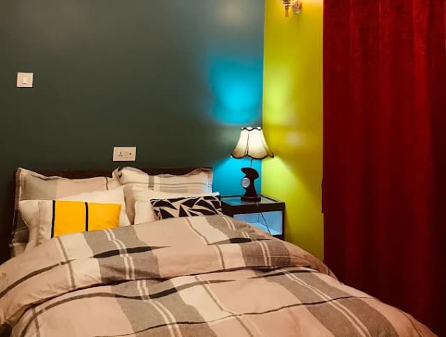 Deluxe double room with warm accent lighting