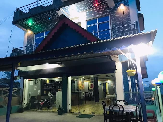 Paul's Hotel terrace glowing in the evening with hill views